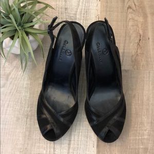 Cole Hana black sling back pumps.
